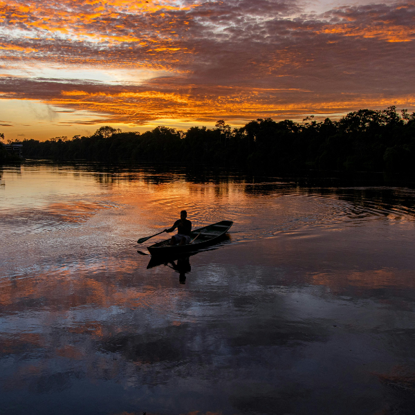 Seaplane descending onto the black water of the Rio Negro beside an Amazon lodge in Brazil
